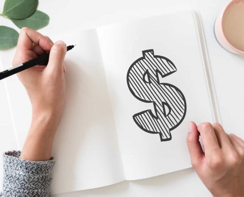 Un dollar dessiné sur un cahier